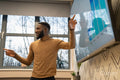 Businessman giving presentation in office