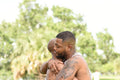 Louisiana, couple embracing in park