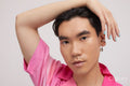 Studio portrait of handsome man with ear piercing