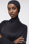 Studio portrait of young woman in hijab