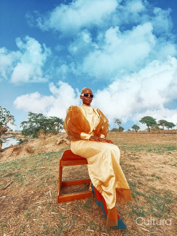 Fashion shot of young woman in savanna