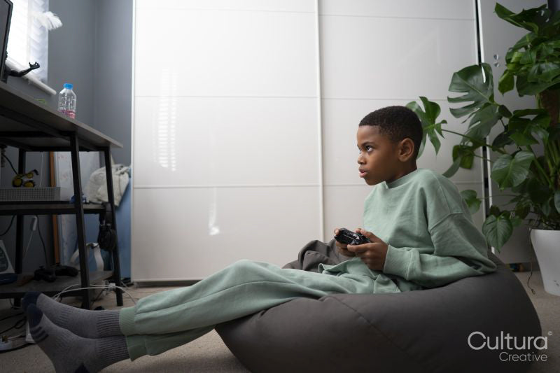 Boy playing video games at home