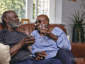 Couple sitting on sofa and drinking wine