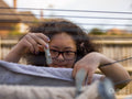 Girl hanging laundry in backyard