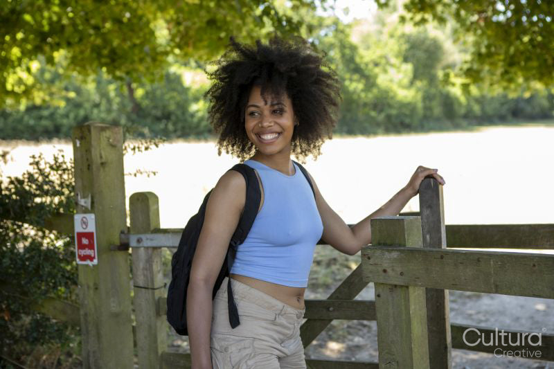 Portrait of young female hiker in countryside
