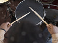 Teenage boy practicing playing drums