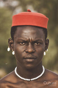 Portrait of young man wearing traditional hat
