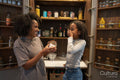 Mother and daughter laughing at pantry