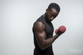 Man training arm with dumbbell