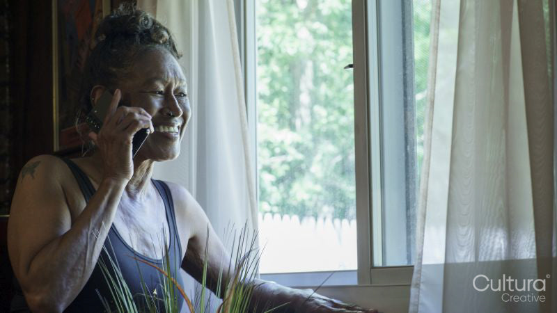 Smiling senior woman talking on phone
