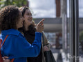 Smiling couple looking at store window