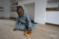 Boy playing with toy cars