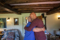Senior male couple playing dancing at home