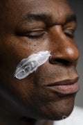 Close-up of man with face cream