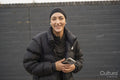 Portrait of young woman holding smartphone