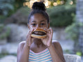 Portrait of girl eating hamburger