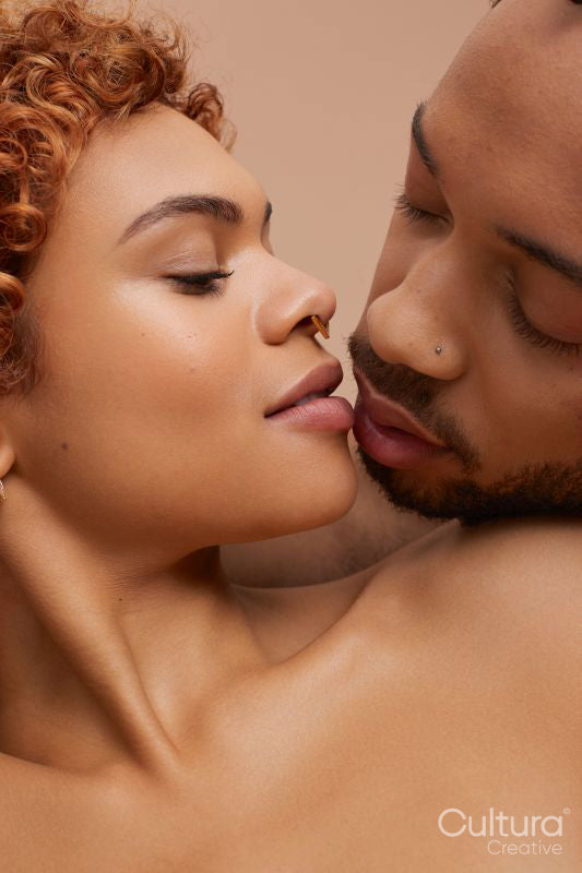 Studio portrait of kissing couple