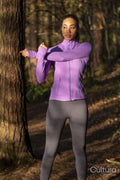 Young woman stretching in forest