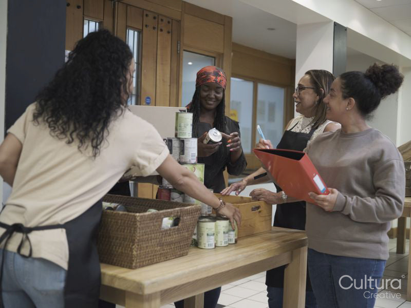 Female volunteers working in community food center