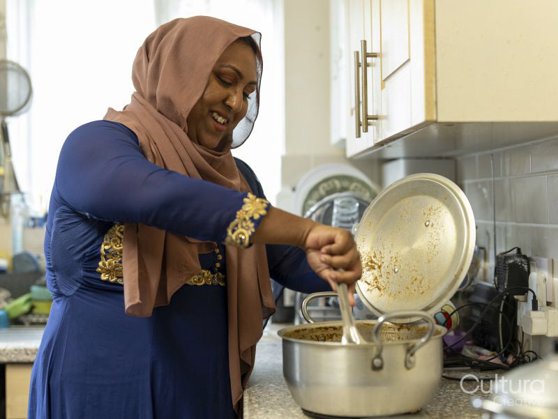 Woman preparing meal for Ramadan celebration at home