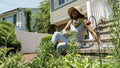 Senior woman sitting in garden