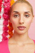 Portrait of blond woman with floral garlands