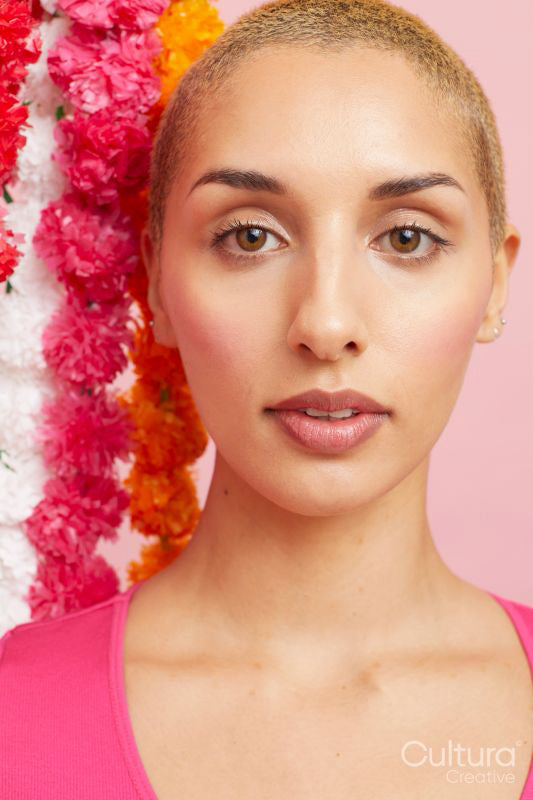Portrait of blond woman with floral garlands