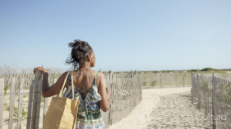 Senior woman looking at view on beach