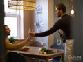 couple celebrating with wine at home