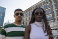 Fashionable young people wearing sunglasses,looking at camera