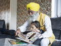 Grandfather playing with grandson at home