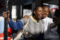 Young female friends taking selfie on merry-go-round