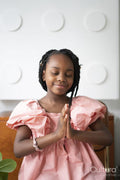 Smiling girl praying