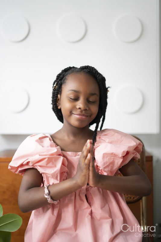 Smiling girl praying