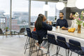 Office workers spending time together in canteen