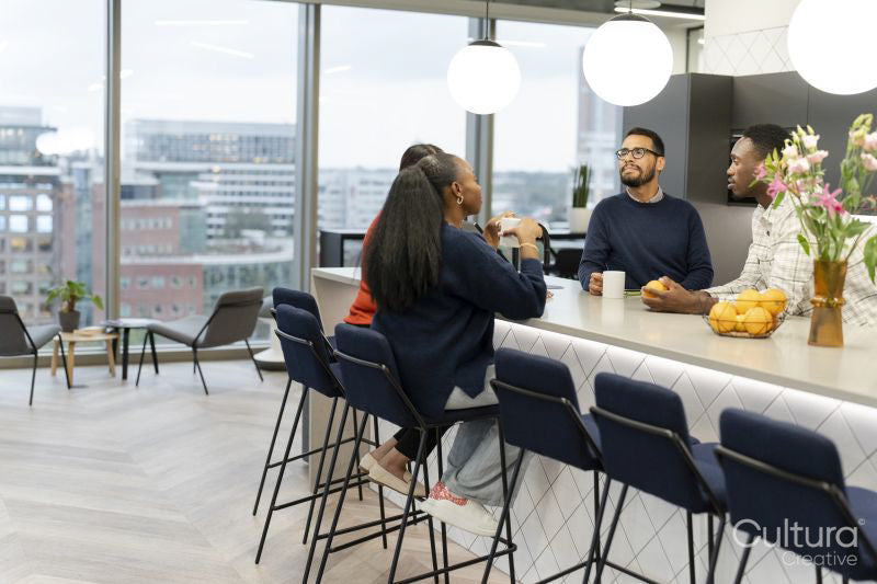 Office workers spending time together in canteen