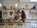 Family preparing food in kitchen