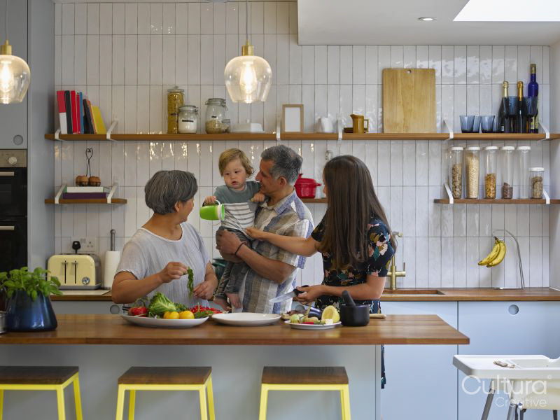 Family preparing food in kitchen