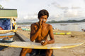 Indonesia, Lombok, Male surfer applying sun lotion on face