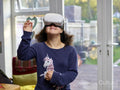 Girl with Down syndrome using virtual reality simulator