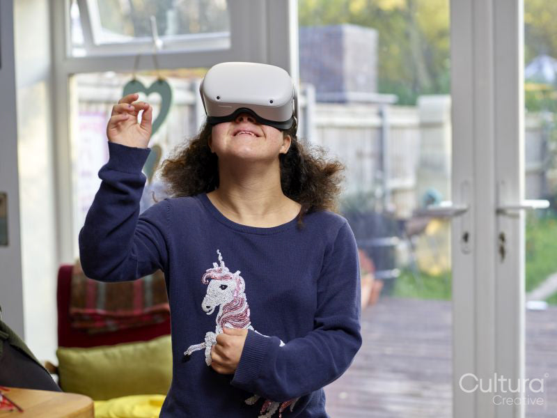 Girl with Down syndrome using virtual reality simulator