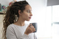 Woman drinking coffee at home